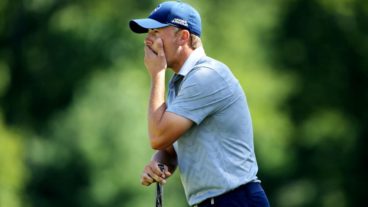 Jordan Spieth reacts after missing a birdie putt at No. 18 during the first round of the Barclays golf tournament on Thursday.