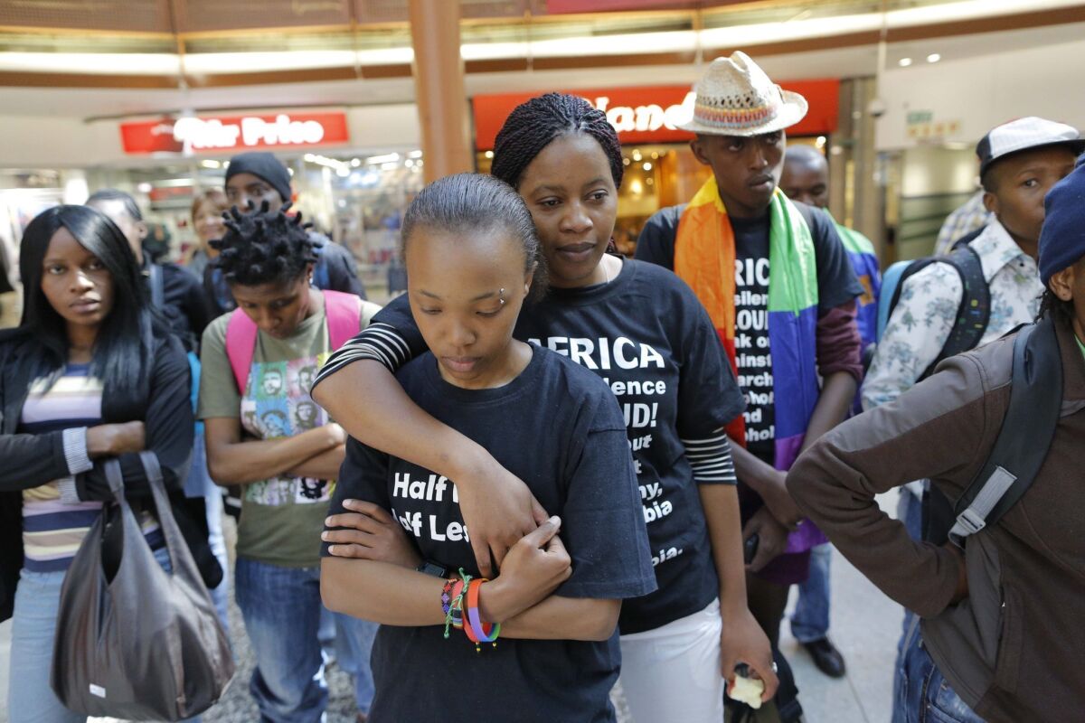 Activists gather during a flash mob event at a major city mall in Johannesburg, South Africa, to support the International Day against Homophobia and Transphobia.