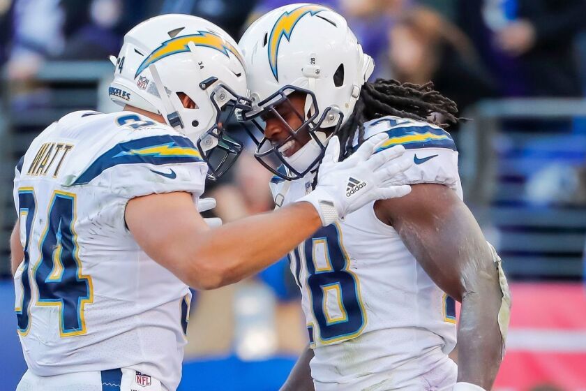 Mandatory Credit: Photo by ERIK S LESSER/EPA-EFE/REX (10049260r) Los Angeles Chargers running back Melvin Gordon (R) reacts with Los Angeles Chargers fullback Derek Watt (L) after Gordon scored a touchdown against the Baltimore Ravens during the second half of the NFL American football AFC wild card playoff game between the Los Angeles Chargers and the Baltimore Ravens at the M&T Bank Stadium in Baltimore, Maryland, USA, 6 January 2019. The Chargers defeated the Ravens. Los Angeles Chargers at the Baltimore Ravens, USA - 06 Jan 2019 ** Usable by LA, CT and MoD ONLY **