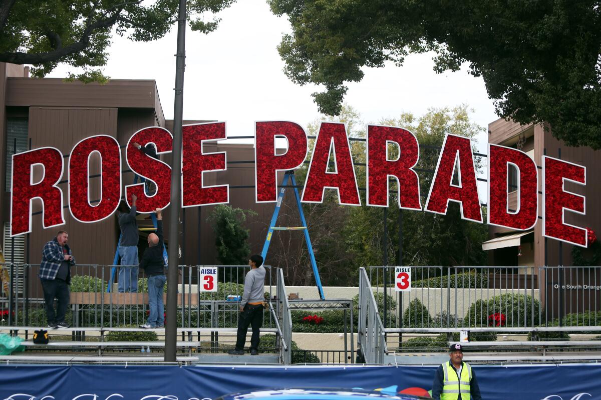 A crew sets up for the Rose Parade in Pasadena