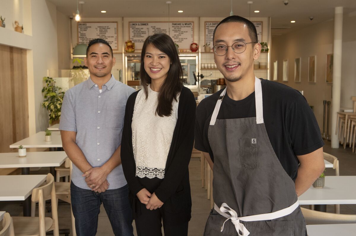 Yang's Kitchen's co-owners Joseph Marcos, Maggie Ho and Chris Yang.