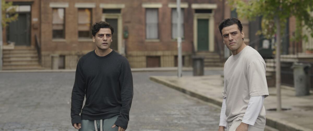 Two men standing in a street