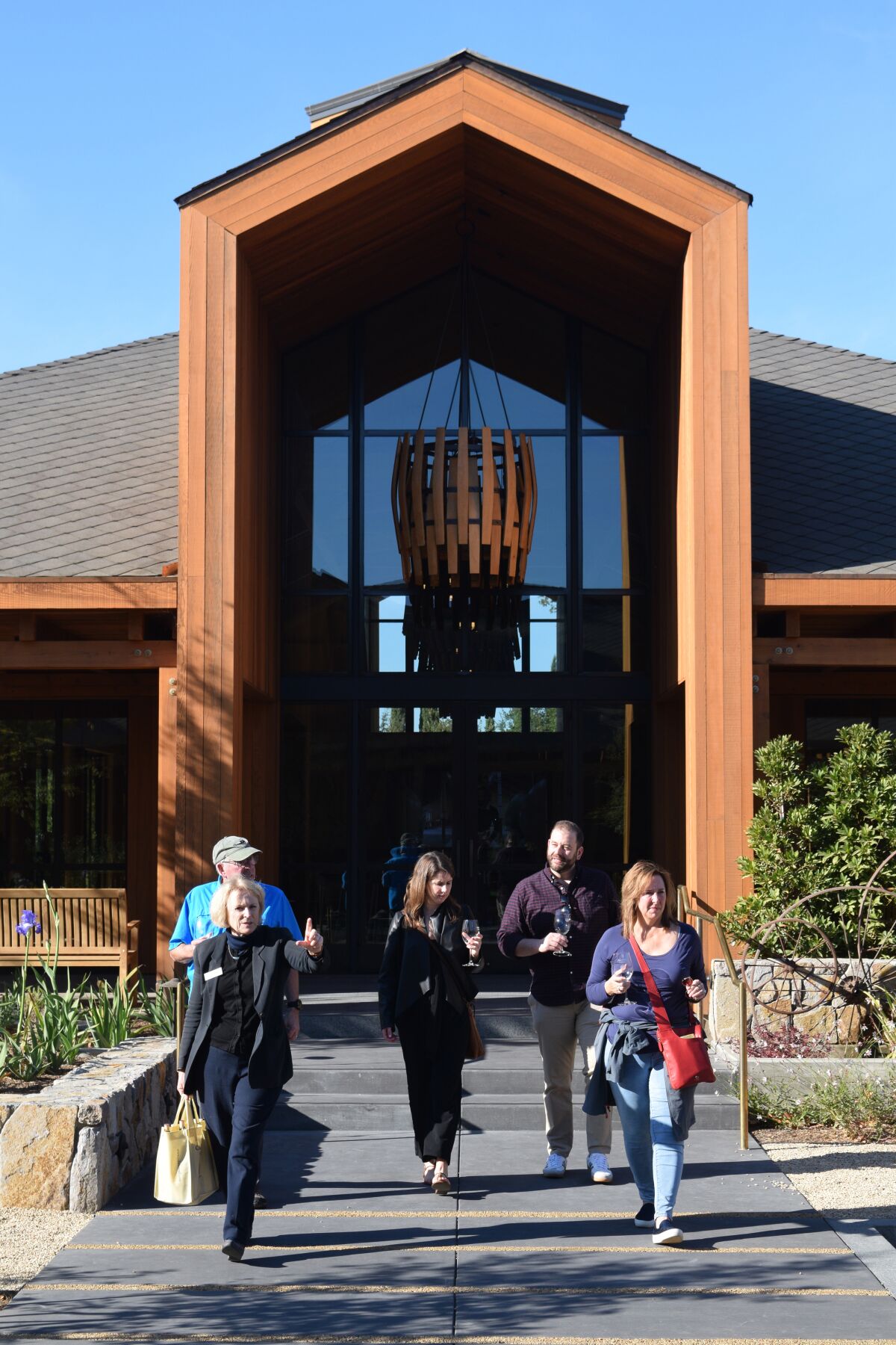 Cakebread Cellars in Rutherford, Calif., has an expansive new visitors center. Here, wine tasters head off on a tour of the facilities.
