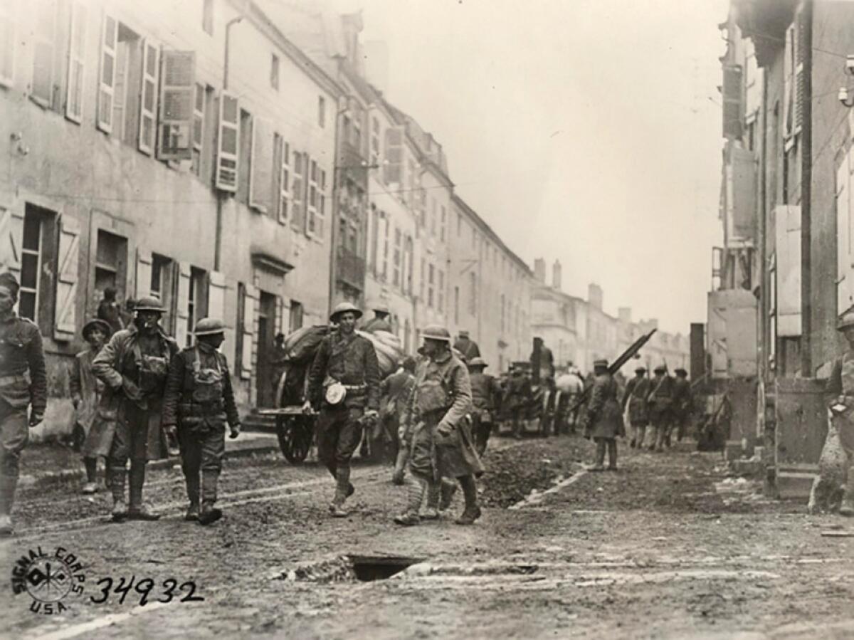 Nov. 11, 1918: Members of the 89th Infantry Division's 353rd Regiment, Company A, enter Stenay, France, following the end of World War I.