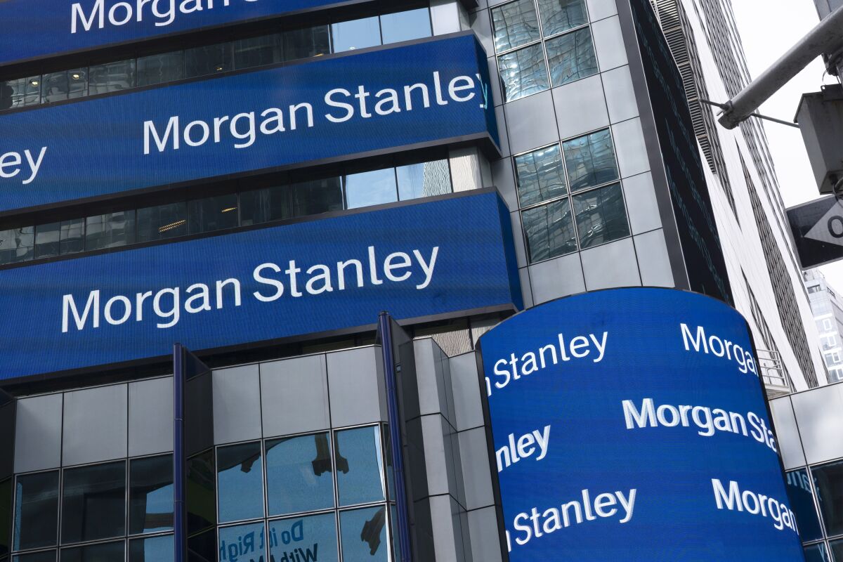 FILE - Electronic signage is shown at Morgan Stanley headquarters, Thursday, March 4, 2021 in New York. Investment bank Morgan Stanley said, Wednesday, Jan. 19, 2022, its fourth-quarter profits rose 9% from a year ago, helped by a big jump in fee revenue from its growing asset and wealth management business.(AP Photo/Mark Lennihan)