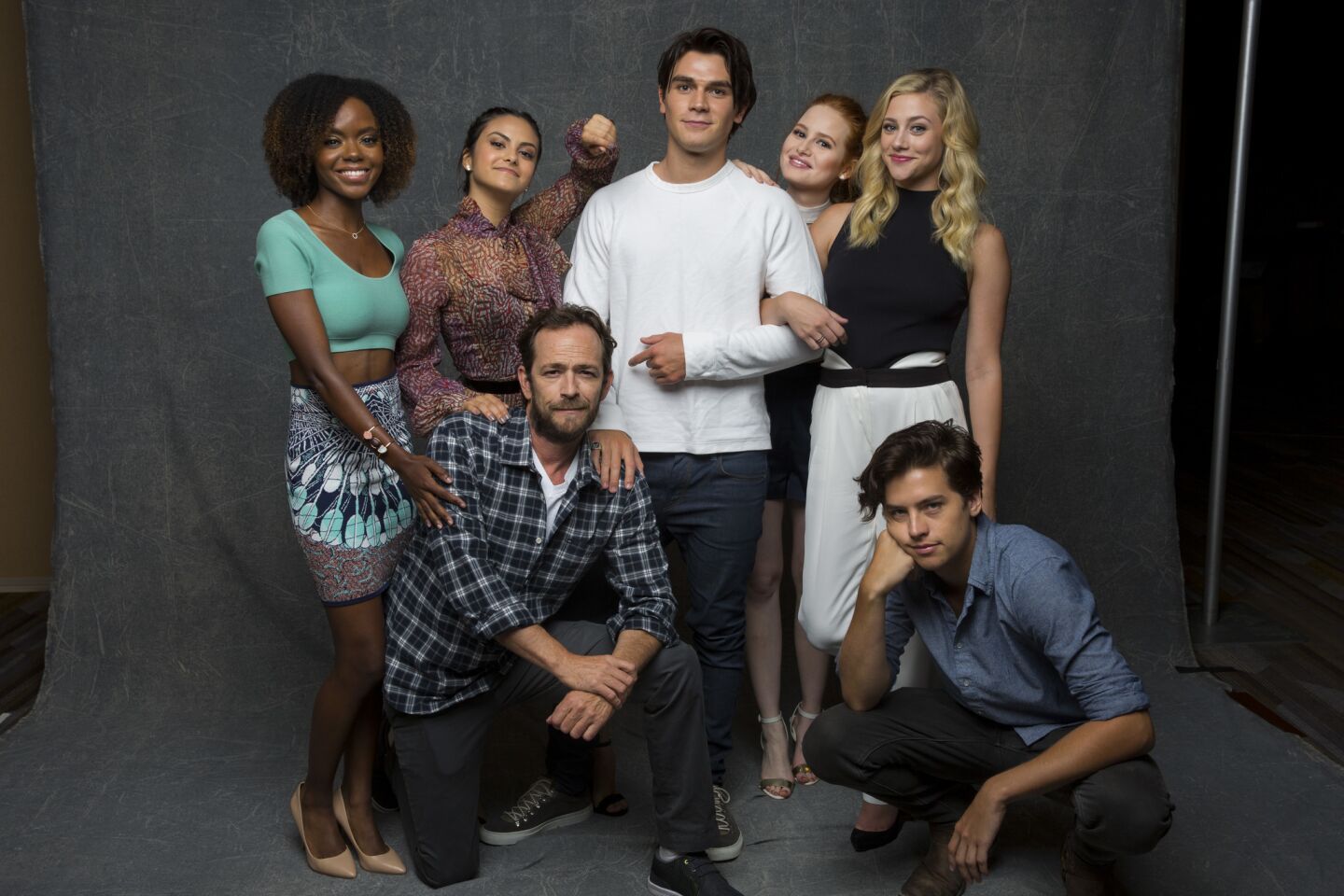 Ashleigh Murray from left, Camilia Mendes, Luke Perry, KJ Apa, Madelaine Petsch, Lili Reinhart and Cole Sprouse of the CW's "Riverdale, " photographed in the L.A. Times Hero Complex photo studio at Comic-Con 2016, in San Diego, July 23, 2016.