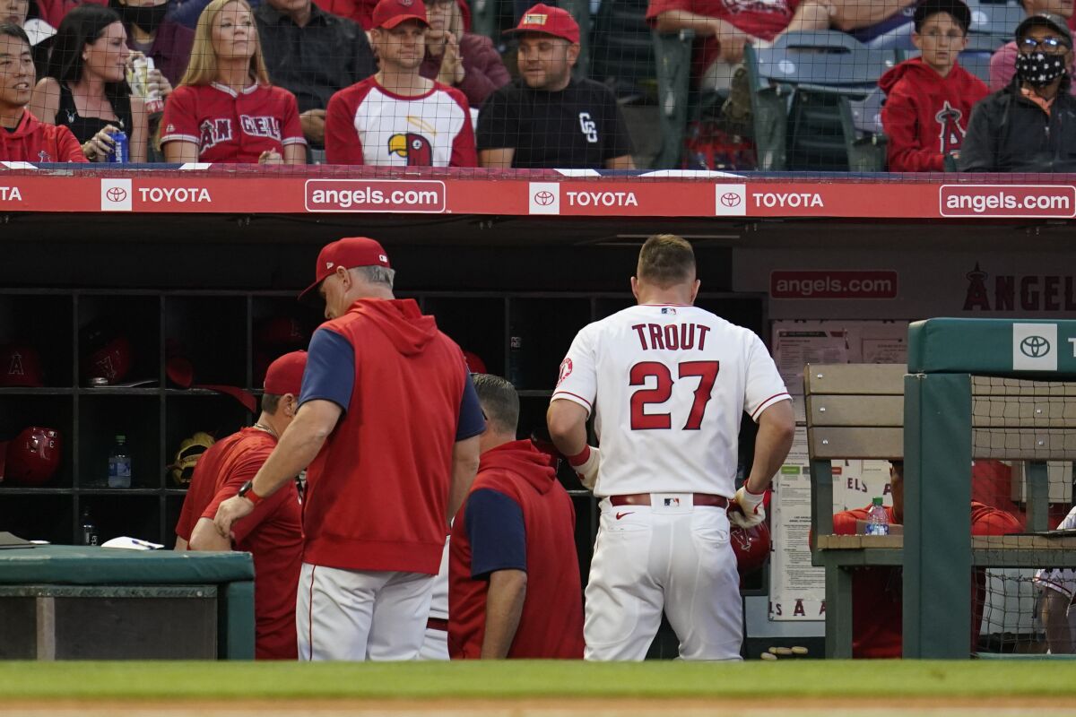 The Angels' Mike Trout leaves the field during the third inning against the Boston Red Sox.