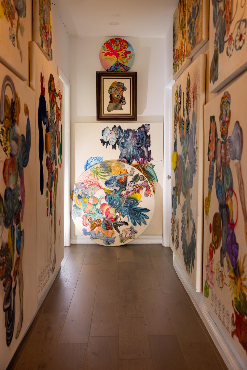A hallway filled with paintings 