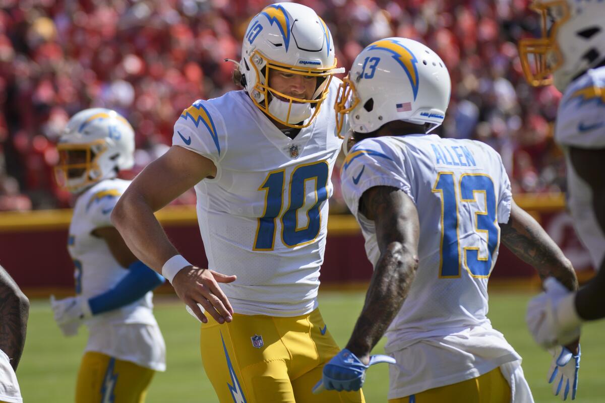 Chargers quarterback Justin Herbert, left, celebrates with wide receiver Keenan Allen.