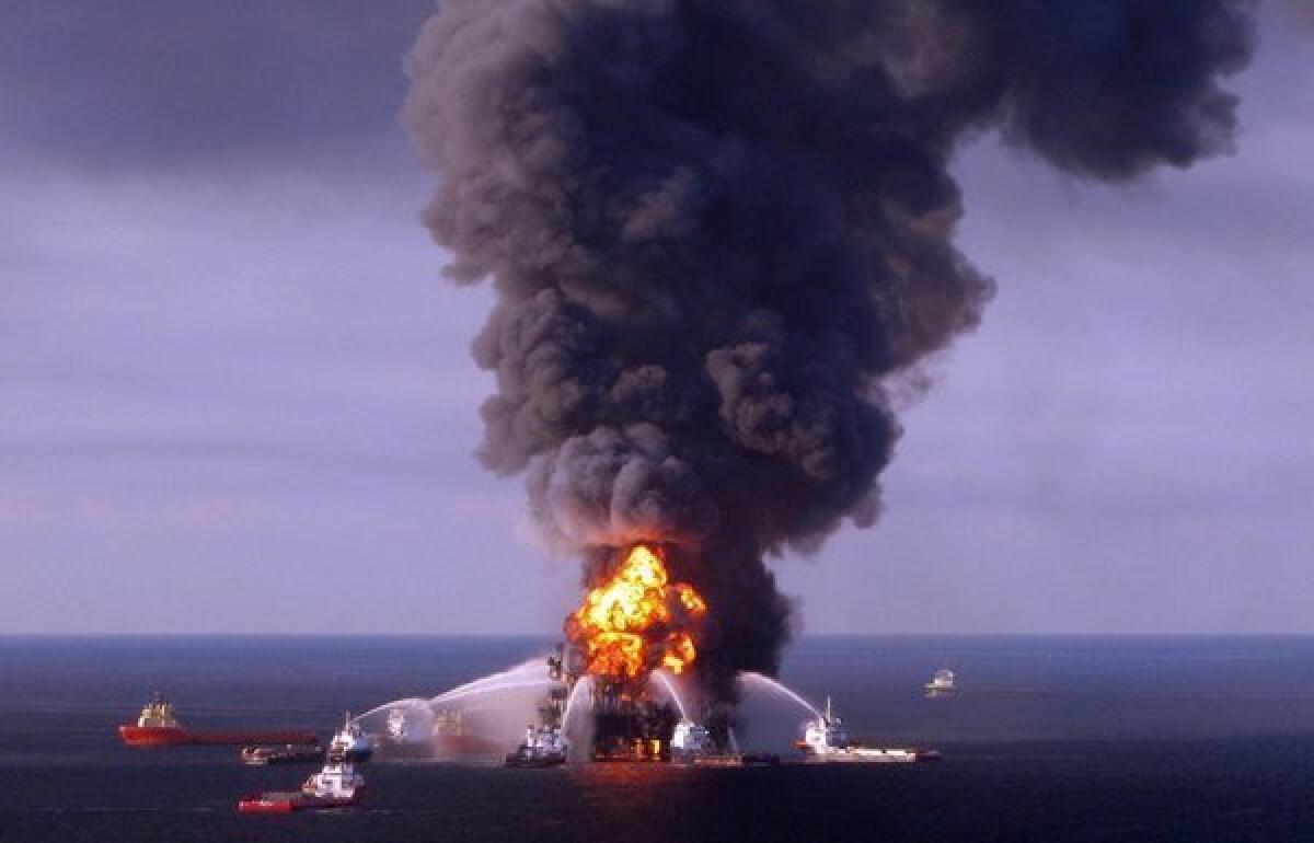 A U.S. Coast Guard handout image of fire boat response crews as they battle the blazing remnants of the BP-operated offshore oil rig, Deepwater Horizon, in the Gulf of Mexico. BP will pay a record criminal penalty to resolve some of its liability for the 2010 Deepwater Horizon disaster that killed 11 workers.