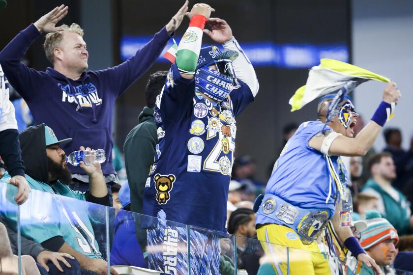 Chargers fans cheer during a home game against the Dolphins.