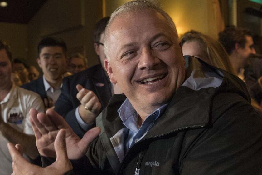 Republican congressional candidate Denver Riggleman claps with the crowd during an election party in Afton, Va., Tuesday, Nov. 6, 2018. (AP Photo/Lee Luther Jr.)