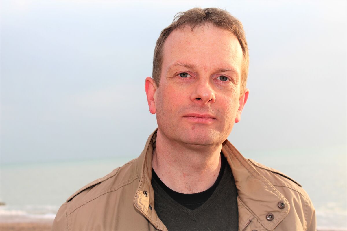 Portrait of a man wearing a jacket outdoors