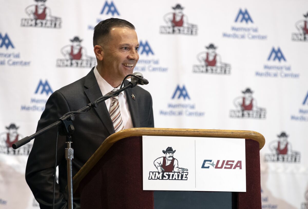 Newly appointed New Mexico State NCAA college basketball coach Jason Hooten speaks during his introduction event in Las Cruces, N.M., Sunday, March 26, 2023. (AP Photo/Andres Leighton)