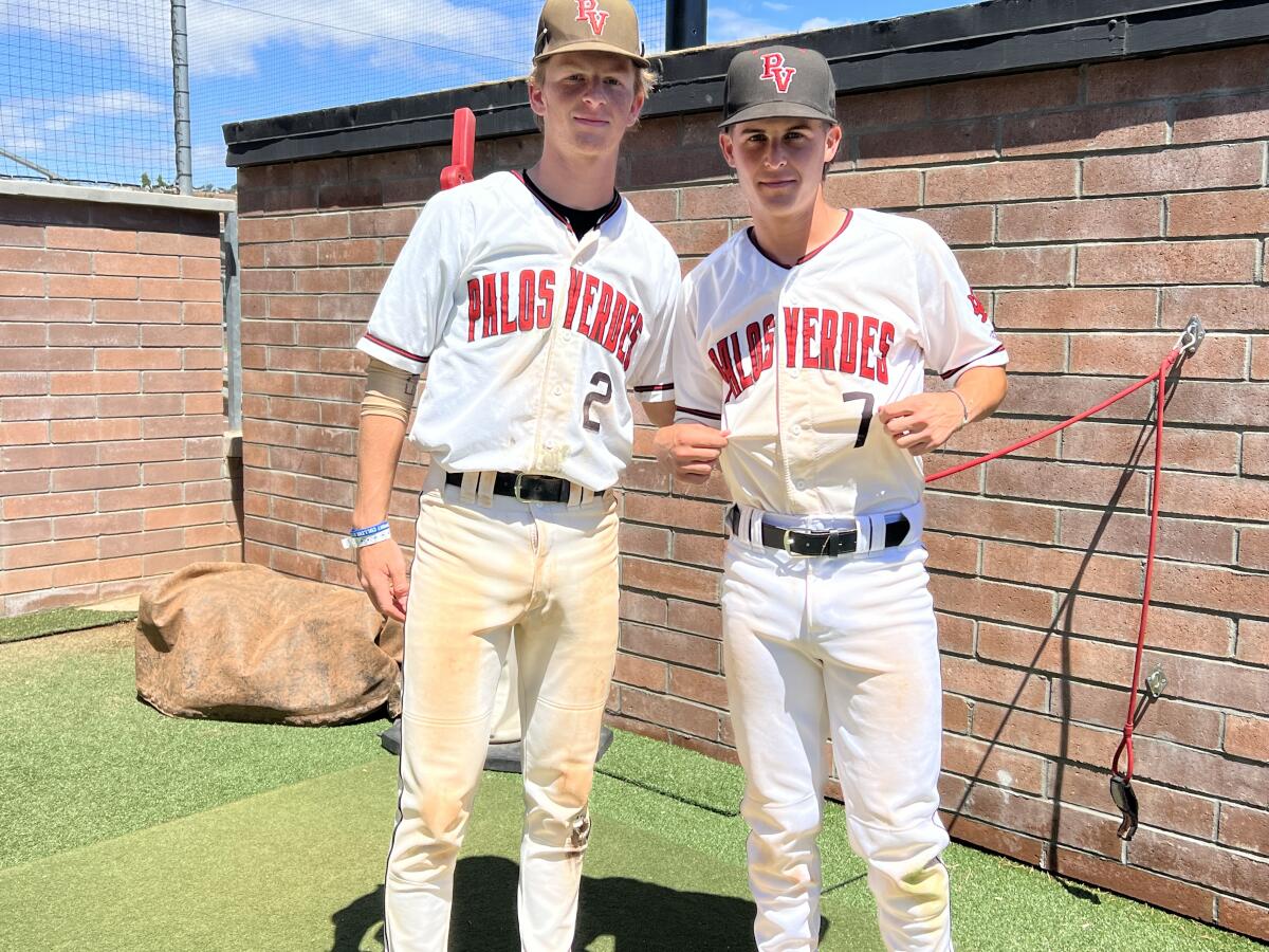 Palos Verdes players Owen Griffiths (left) and Alex Forman show up with dirty uniforms for day 2 of a suspended game. 