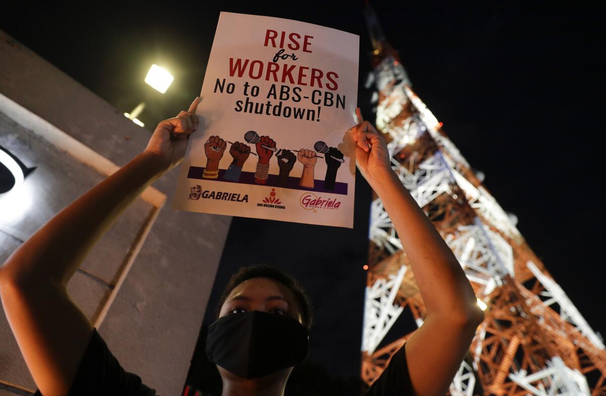 An activist outside the headquarters of broadcast network ABS-CBN in Quezon City, Philippines, on Tuesday.