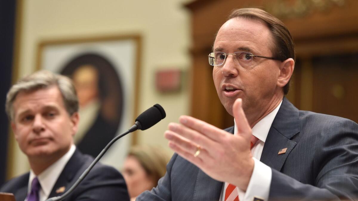 FBI Director Christopher Wray, left, and Deputy Atty. Gen. Rod Rosenstein testify before the House Judiciary Committee on Thursday.