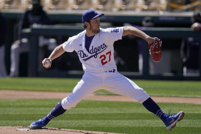 Los Angeles Dodgers starting pitcher Trevor Bauer throws against the Colorado Rockies during the first inning of a spring training baseball game Monday, March 1, 2021, in Phoenix. (AP Photo/Ross D. Franklin)