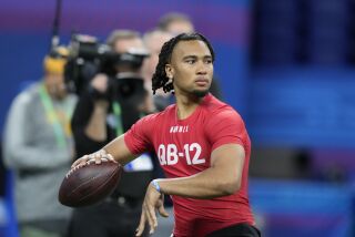 Ohio State quarterback CJ Stroud runs a drill at the NFL football scouting combine in Indianapolis, Saturday, March 4, 2023. (AP Photo/Michael Conroy)