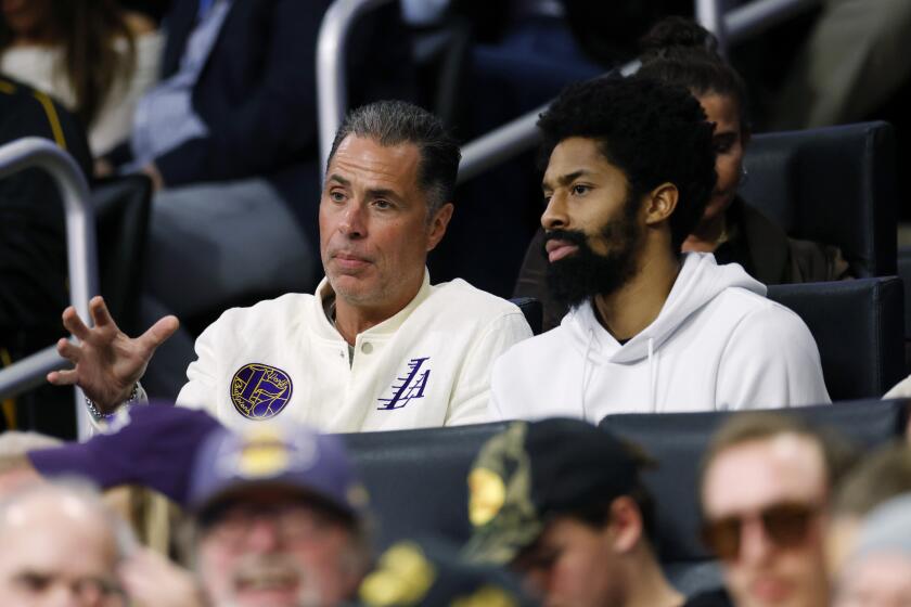 Lakers general manager Rob Pelinka talks to free agent Spencer Dinwiddie at Crypto.com Arena.