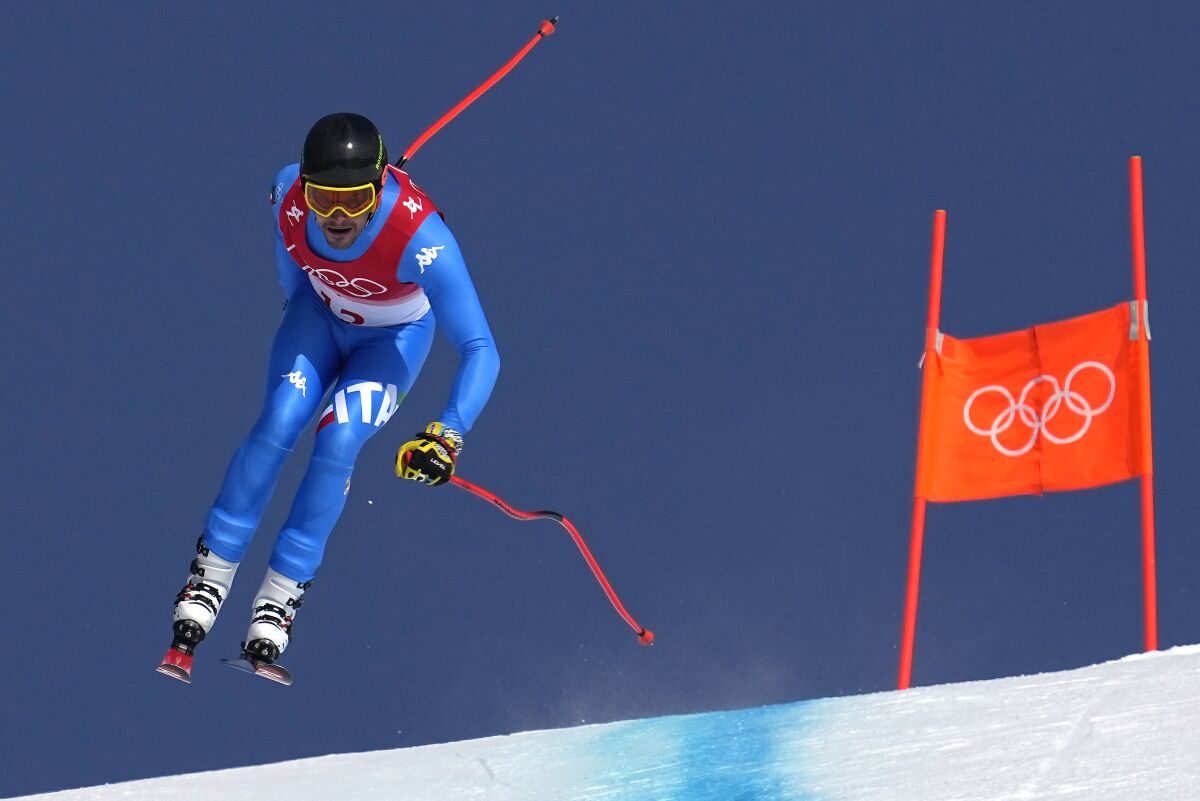 Christof Innerhofer, of Italy makes a jump during the downhill part of the men's combined at the 2022 Winter Olympics, Thursday, Feb. 10, 2022, in the Yanqing district of Beijing. (AP Photo/Robert F. Bukaty)