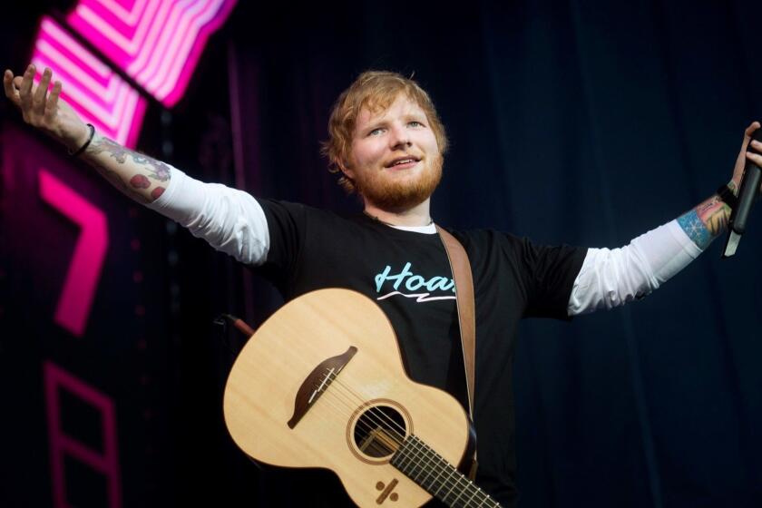 Mandatory Credit: Photo by Luca Piergiovanni/EPA-EFE/REX (10302578e) Ed Sheeran performs during a concert at Wanda Metropolitano stadium in Madrid, Spain, 11 June 2019. Ed Sheeran in concert, Madrid, Spain - 11 Jun 2019 ** Usable by LA, CT and MoD ONLY **