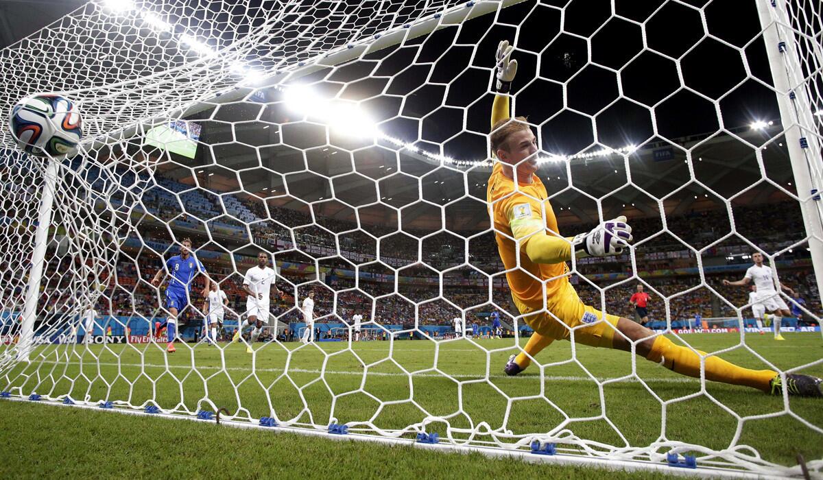 England goalkeeper Joe Hart can't stop a shot by Italy forward Mario Balotelli in the second half of a World Cup Group D game on Saturday at the Arena da Amazonia in Manaus, Brazil. Italy won the contest, 2-1.