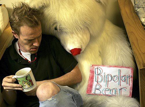 Thomas Mountain, 29, sits next to Bipolar Bear while having a cup of coffee in the Group Room at Daniel's Place in Santa Monica. Daniel's Place assists people ages 18 to 30 who are experiencing their first episodes of mental illness. Mountain has visited the center for the past four years. Daniel's Place is a program of Step Up On Second, a nationally recognized recovery center for people with severe and persistent mental illness.