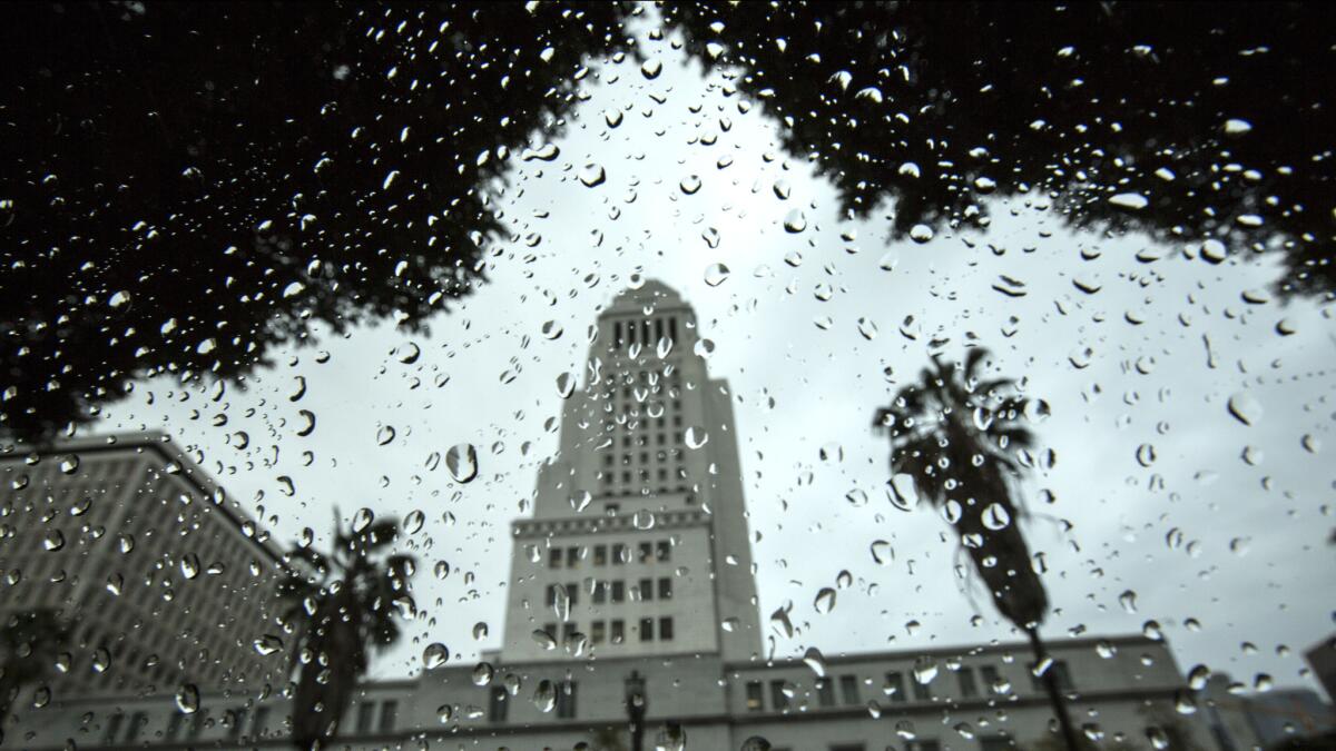 Rain falls on downtown Los Angeles on Friday morning. Storms were moving through parts of Southern California throughout the afternoon.
