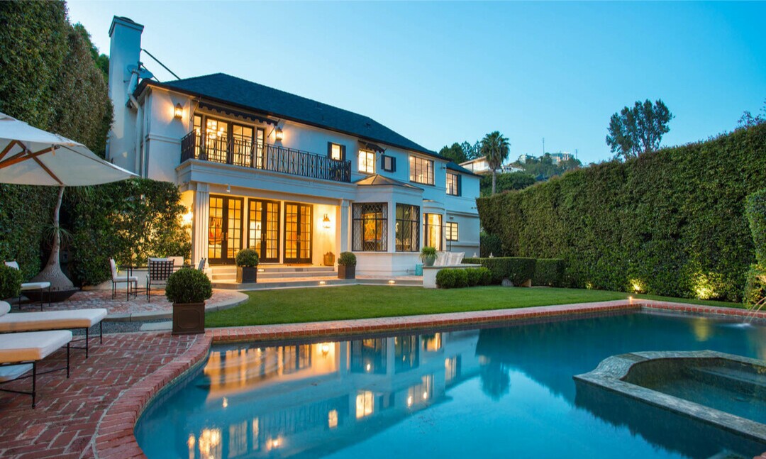 Built in 1936, the elegant Regency-style home showcases dramatic style both inside and out.