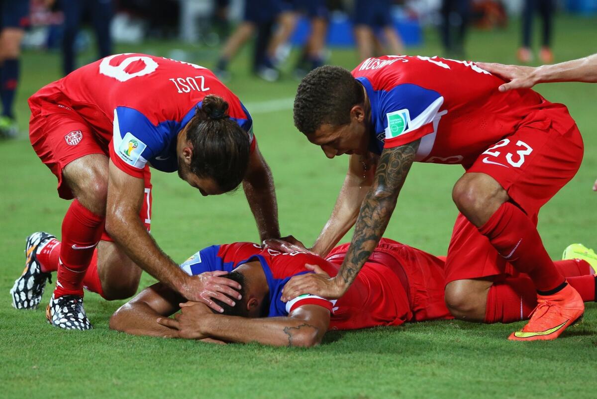 John Brooks, center, is congratulated by his U.S. teammates after scoring the game-winning goal against Ghana.