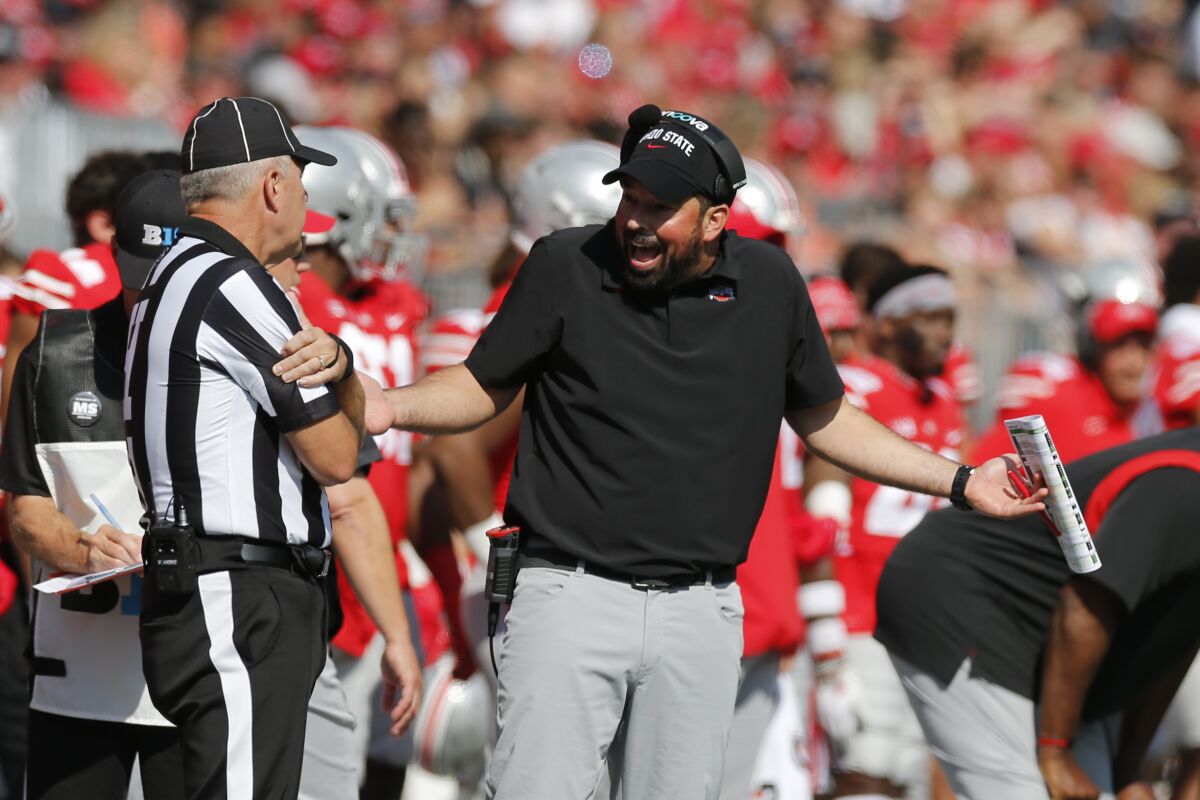 Ohio State head coach Ryan Day argues with a referee during during the first half of an NCAA college football game against Maryland, Saturday, Oct. 9, 2021, in Columbus, Ohio. Ohio State beat Maryland 66-17. (AP Photo/Jay LaPrete)