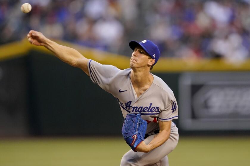 Los Angeles Dodgers starting pitcher Walker Buehler throws against the Arizona Diamondbacks during the first inning of a baseball game, Monday, April 25, 2022, in Phoenix. (AP Photo/Matt York)
