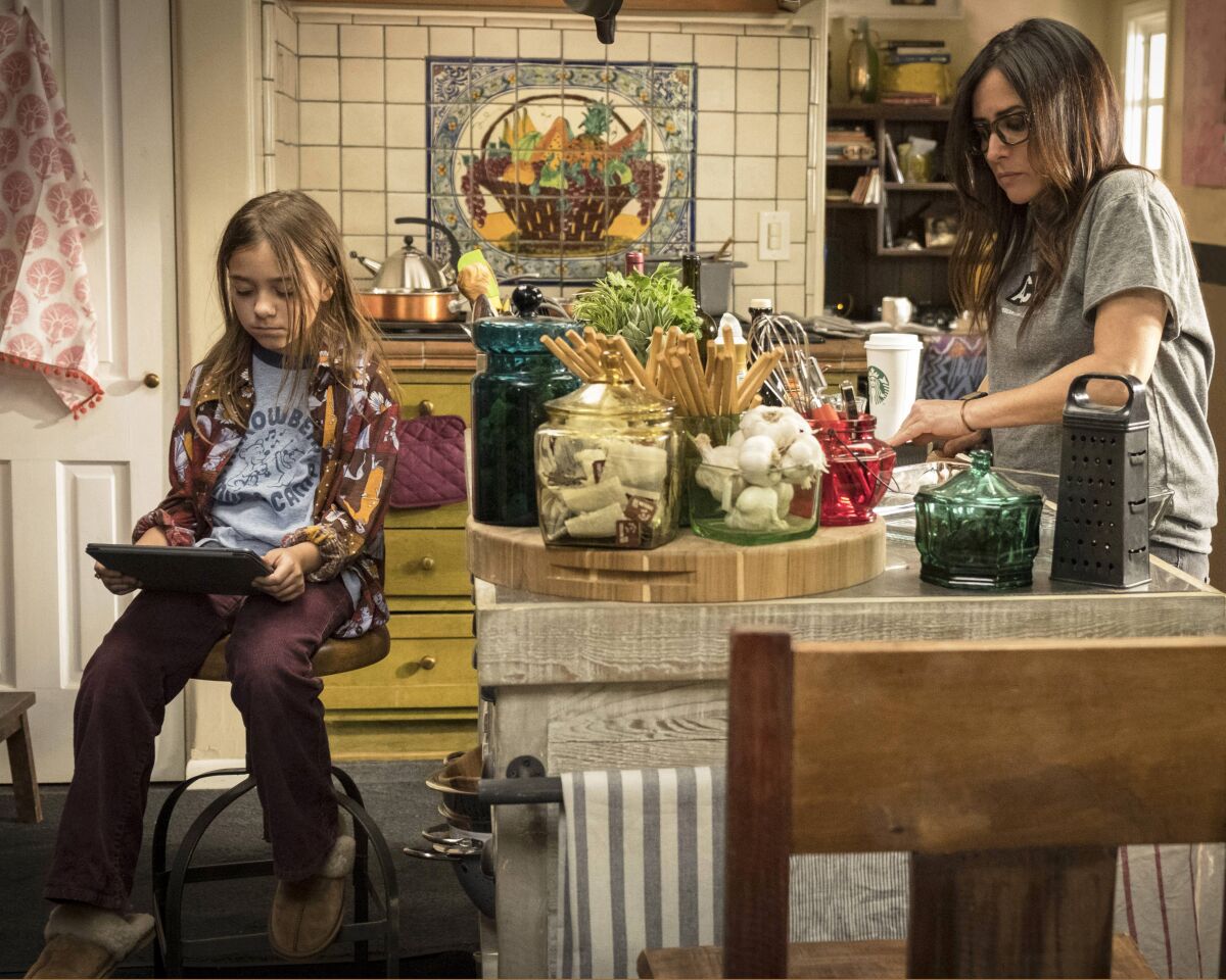 Olivia Edward as Duke Fox, left, and Pamela Adlon as Sam Fox, in the family kitchen in "Better Things."