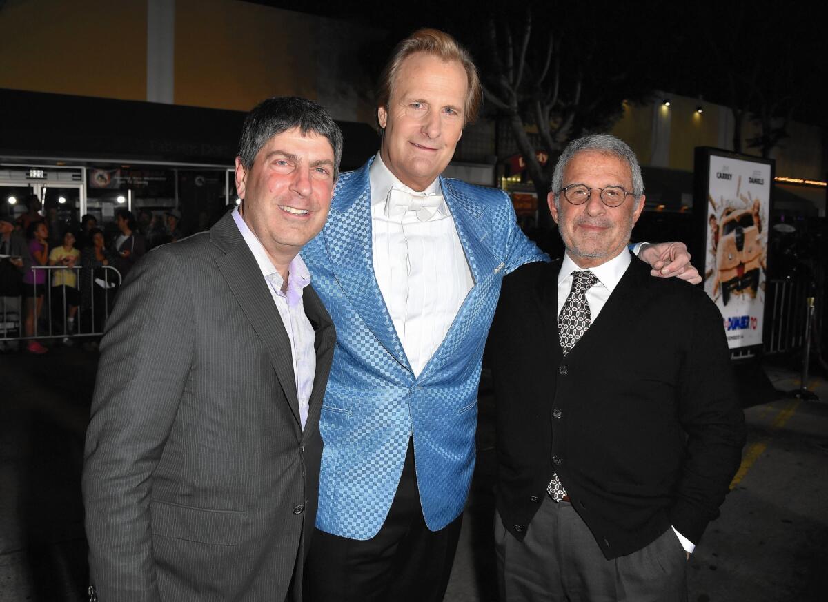 Jeff Shell, chairman of Universal Filmed Entertainment, left, is shown with actor Jeff Daniels and Ron Meyer, vice chairman of NBCUniversal, at the premiere this month of "Dumb And Dumber To" in Westwood.