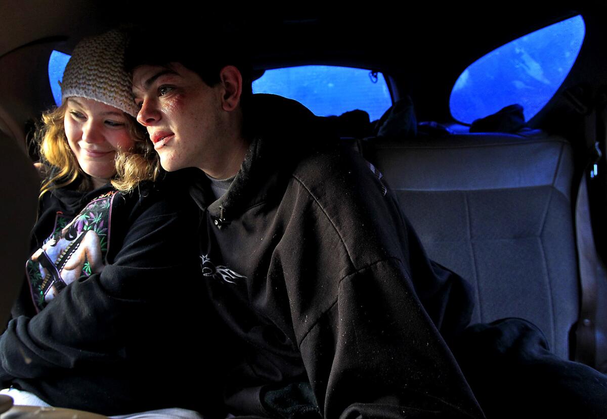 Lea Glynn and boyfriend Cody Wertz wait for checkout time after spending the night in his station wagon in a "safe parking" lot in Sonoma County.