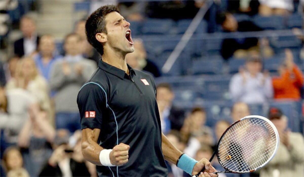 Novak Djokovic celebrates a 6-3, 6-2, 3-6, 6-0 victory over Mikhail Youzhny in a quarterfinal matchup at the U.S. Open.