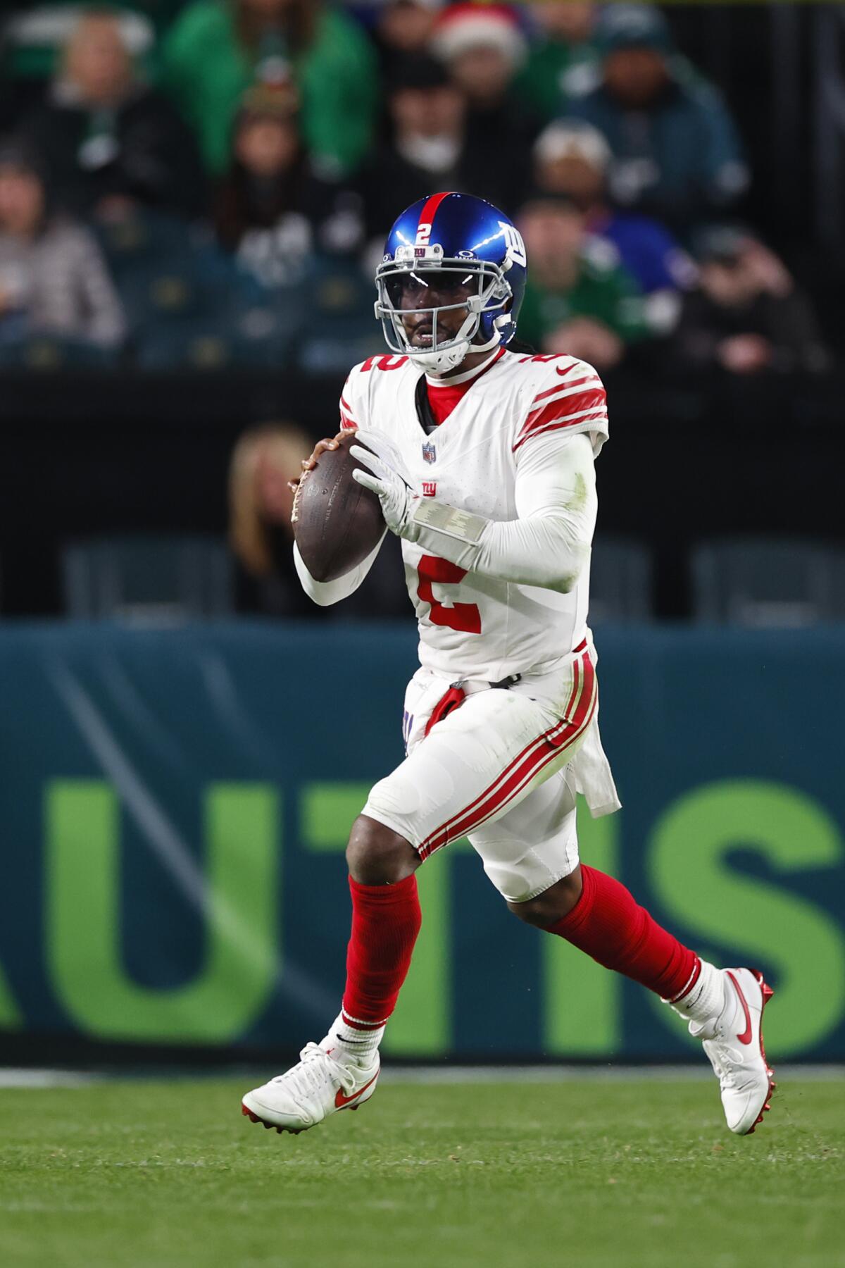 Giants quarterback Tyrod Taylor (2) scrambles against the Philadelphia Eagles. 