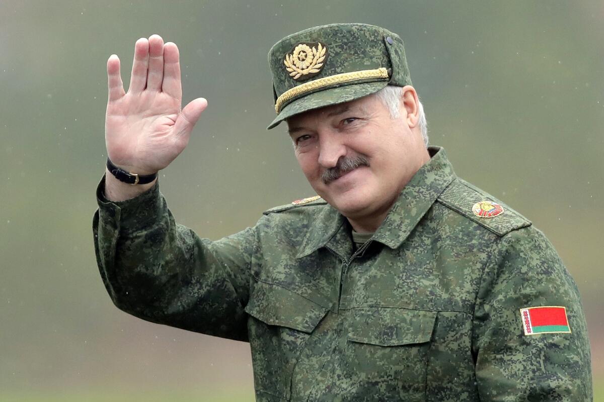 FILE - Belarusian President Alexander Lukashenko waves to the world cup journalists as he arrives at the Zapad (West) 2017 joint Russia-Belarus military exercises at the Borisovsky range in Borisov, Belarus, on Wednesday, Sept. 20, 2017. Lukashenko this week once again accused Ukraine of planning to attack it and announced creating a joint grouping of troops with Moscow, a move that stocked fears that Belarusian army could join Russian forces in Ukrainian trenches. (AP Photo, File)