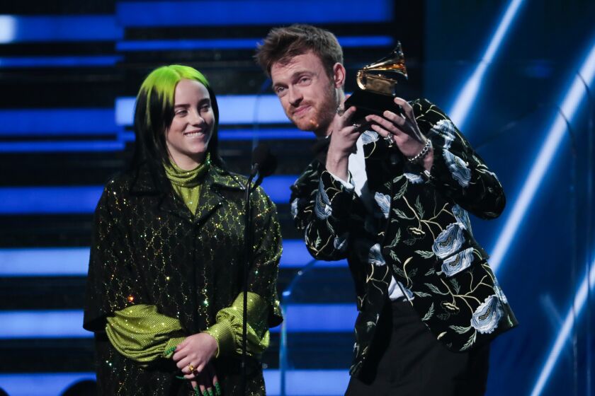 LOS ANGELES, CA - January 26, 2020: Billie Eilish and Finneas O'Connell accept their award on stage at the 62nd GRAMMY Awards at STAPLES Center in Los Angeles, CA. (Robert Gauthier / Los Angeles Times)