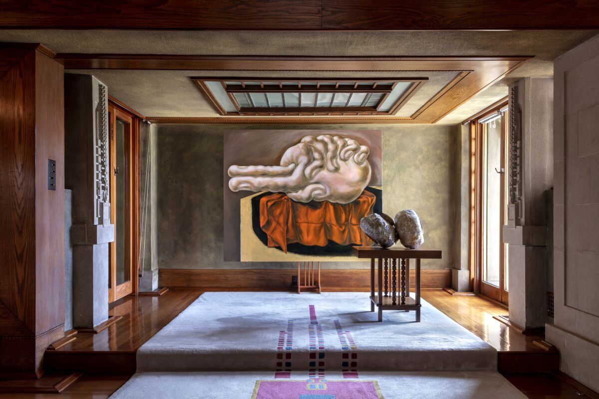 A painting and boulder-like objects in a historic house.