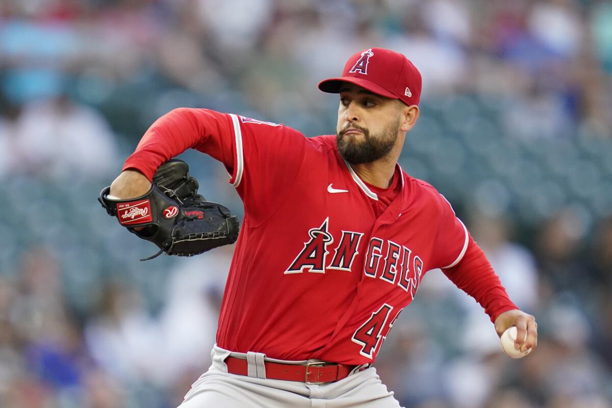 Angels starting pitcher Patrick Sandoval throws against the Seattle Mariners on Saturday.
