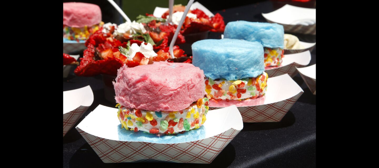 Cotton candy ice cream sandwiches and chocolate pasta bowls, back left, which are new dessert dishes made by Chicken Charlie's.