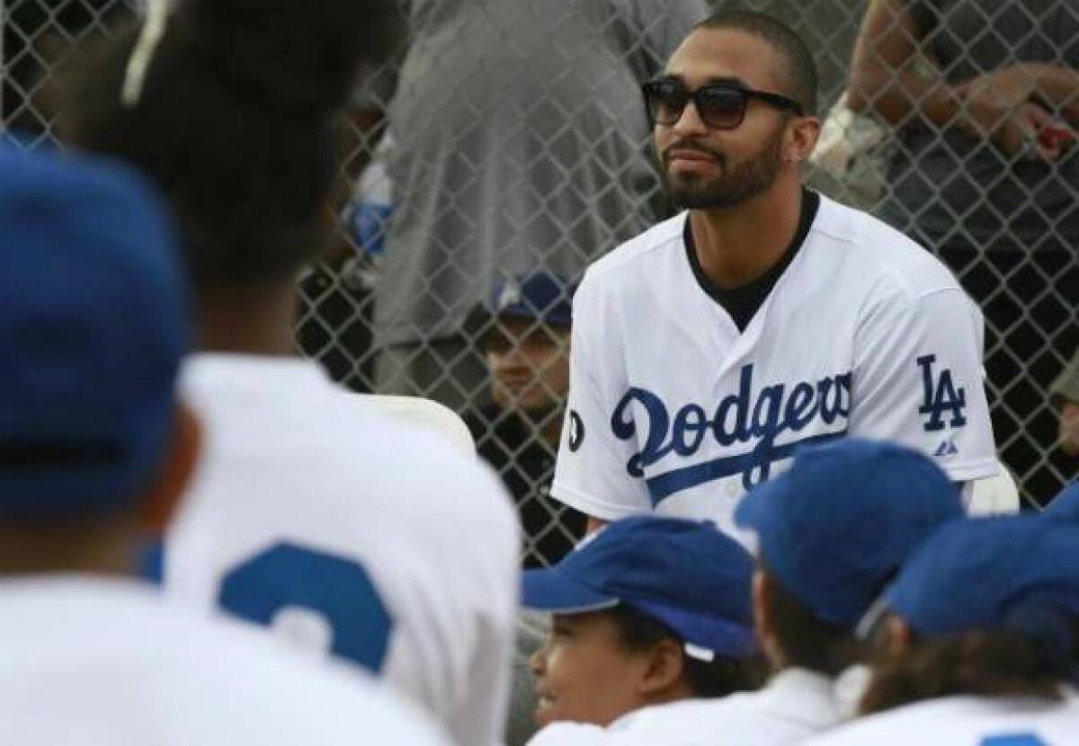 Matt Kemp looks out to a group of school kids all wearing Dodger blue at the dedication of the Dodger Dreamfield at Mona Park in Compton on Nov. 14.