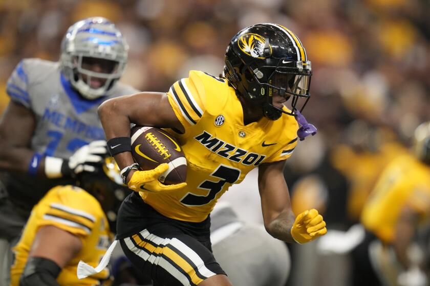 Missouri wide receiver Luther Burden III runs with the ball during the first half of an NCAA college football game against Memphis Saturday, Sept. 23, 2023, in St. Louis. (AP Photo/Jeff Roberson)