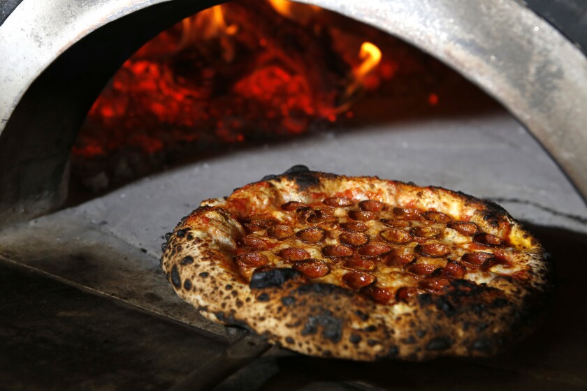 Pepperoni pizza fresh out of the oven at Cosa Buona.