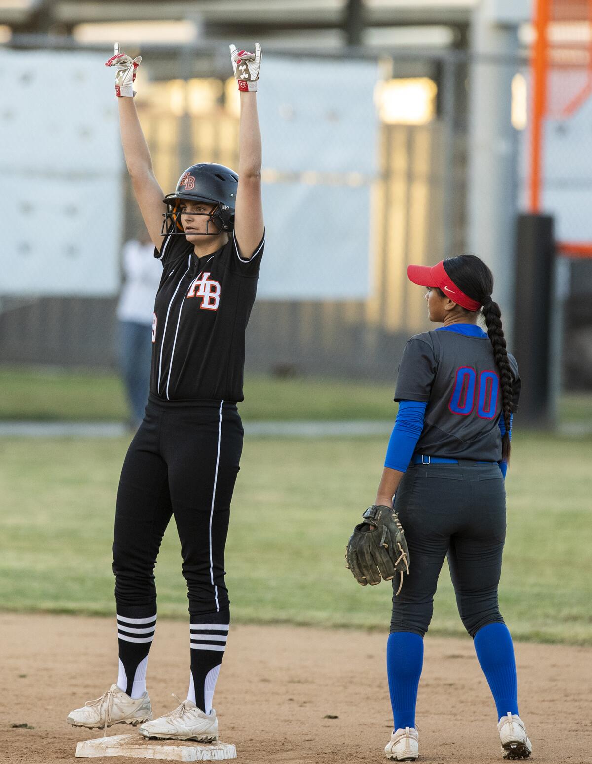 Huntington Beach's Grace Grundstrom celebrates after hitting a double in the second inning against Los Alamitos on Tuesday.