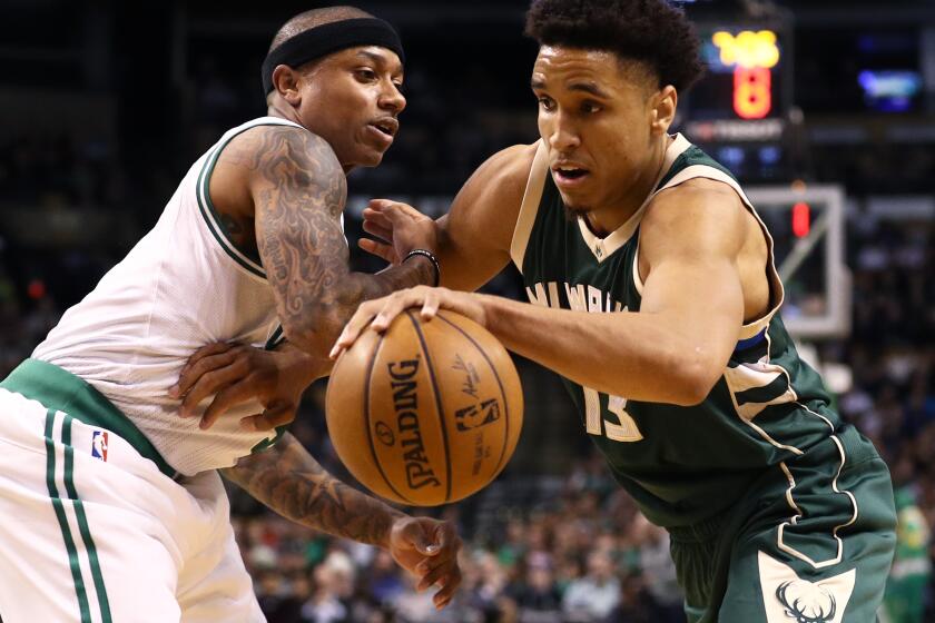Bucks rookie guard Malcolm Brogdon drives past Celtics guard Isaiah Thomas during a game at TD Garden on March 29, 2017.
