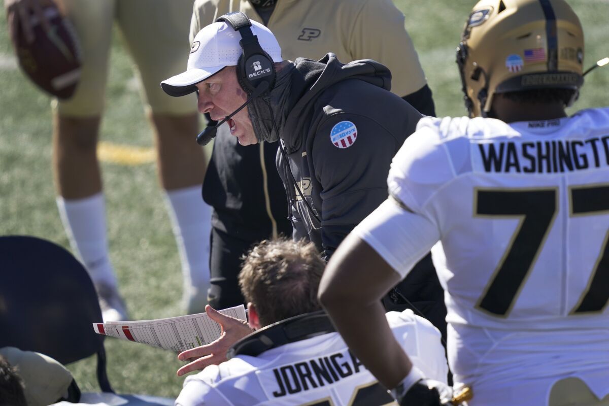 Purdue head coach Jeff Brohm yells at his offensive linemen during the second half of an NCAA college football game against Illinois Saturday, Oct. 31, 2020, in Champaign, Ill. (AP Photo/Charles Rex Arbogast)