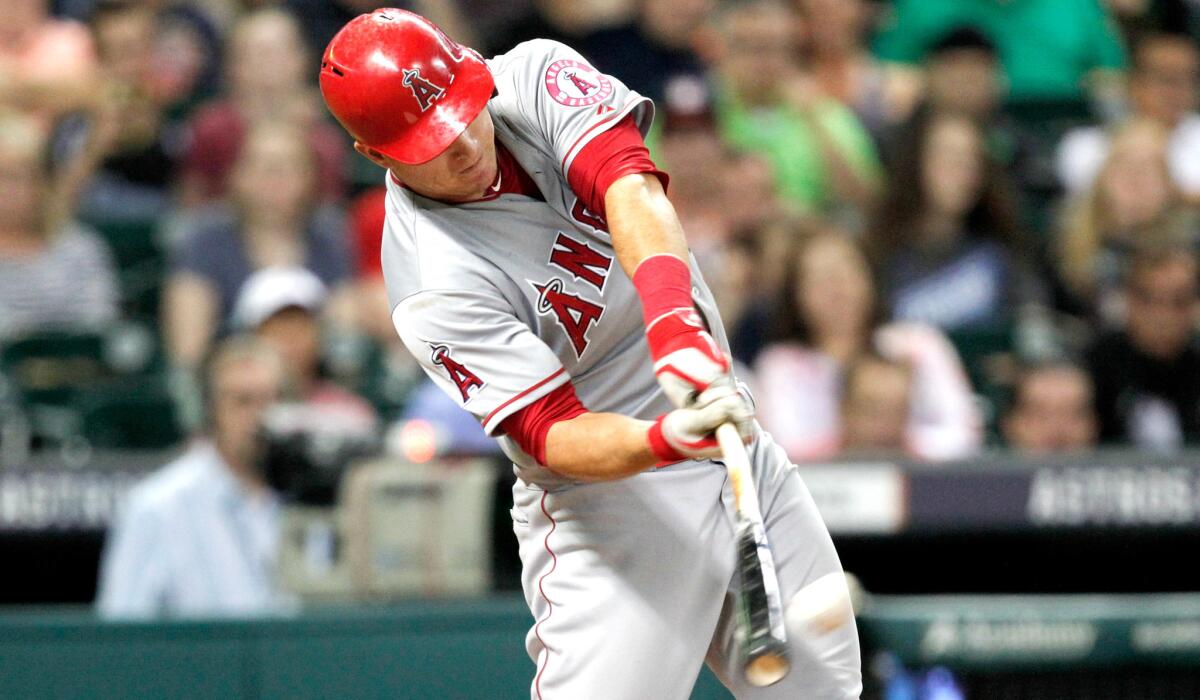 Angels center fielder Mike Trout connects for a two-run home run against the Astors in the sixth inning Friday night in Houston.